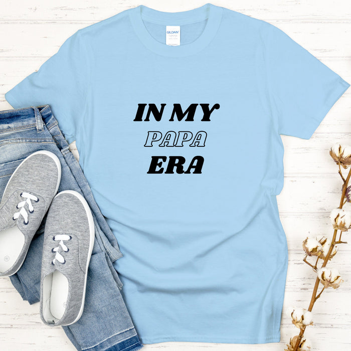 a t - shirt that says in my papa era next to a pair of