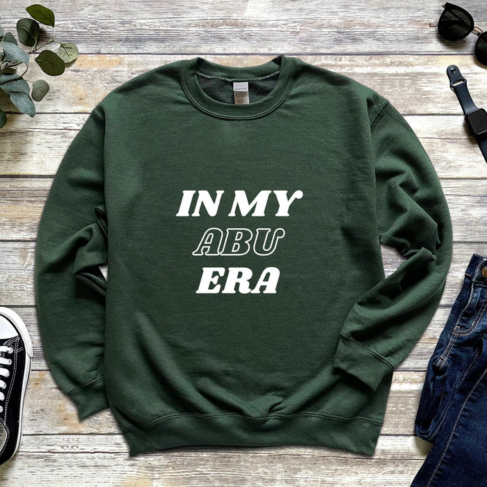 a green sweatshirt with the words in my abu era printed on it