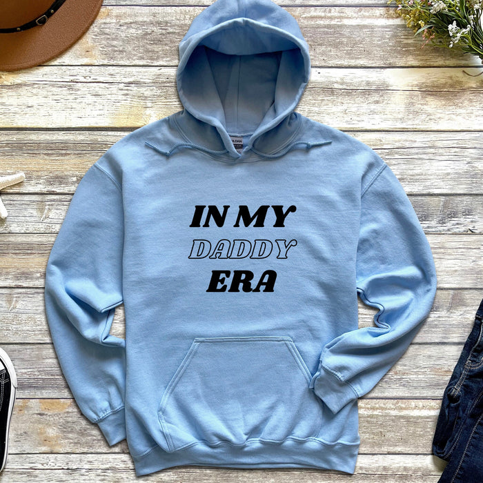 a blue hoodie that says in my daddy era