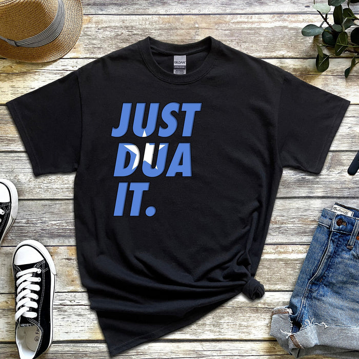 a t - shirt that says just dua it next to a pair of jeans