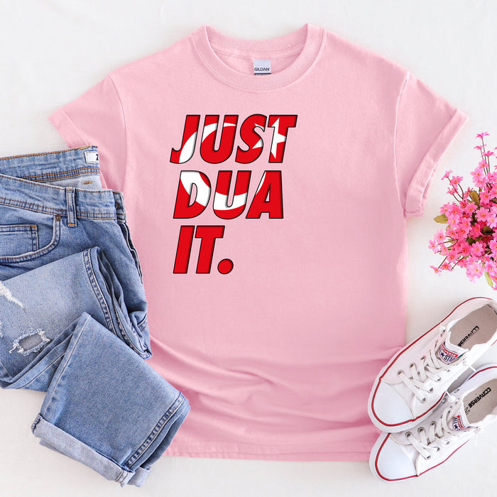 a pink t - shirt that says just do it next to a pair of jeans