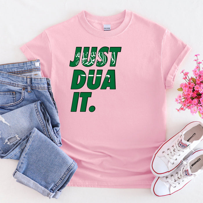 a pink shirt that says just dua it next to a pair of jeans and