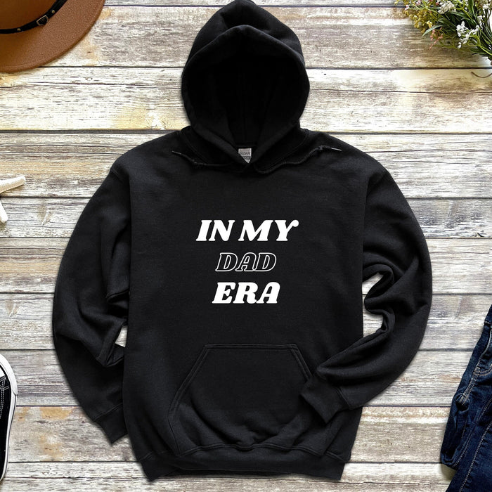 a black hoodie with the words in my dad era printed on it