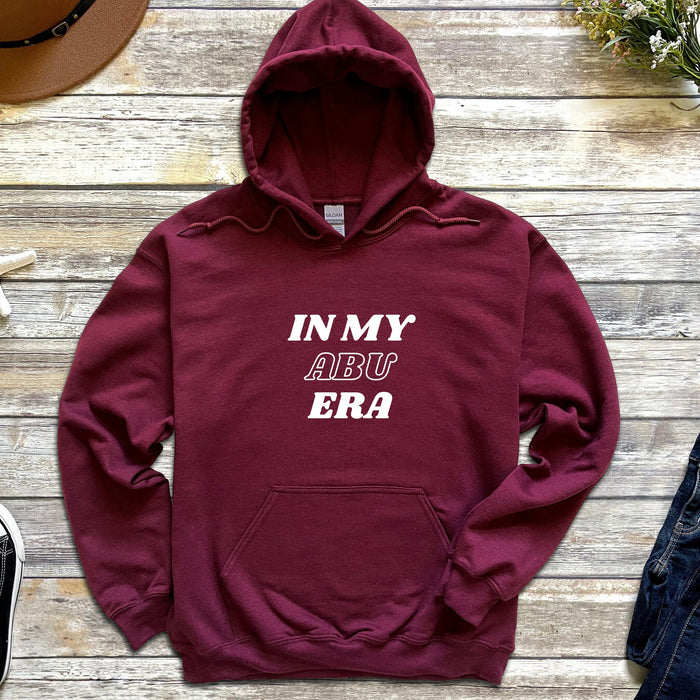 a maroon hoodie that says in my arr era