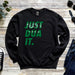 a black sweatshirt with green lettering on it