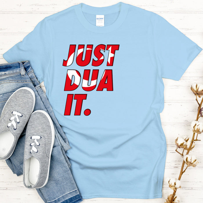 a blue t - shirt that says just dua it next to a pair of